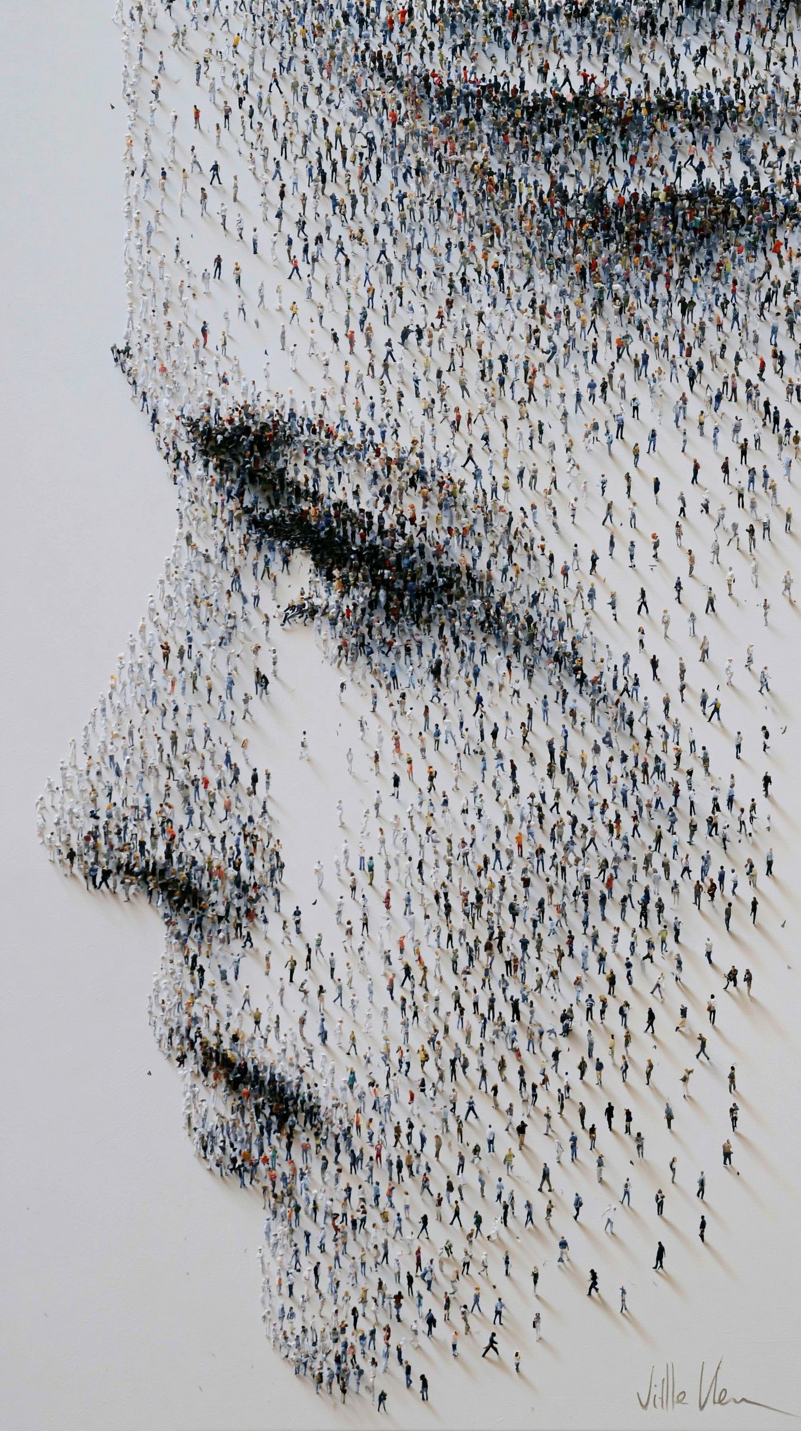 Millions of people form a human face in different poses and shapes