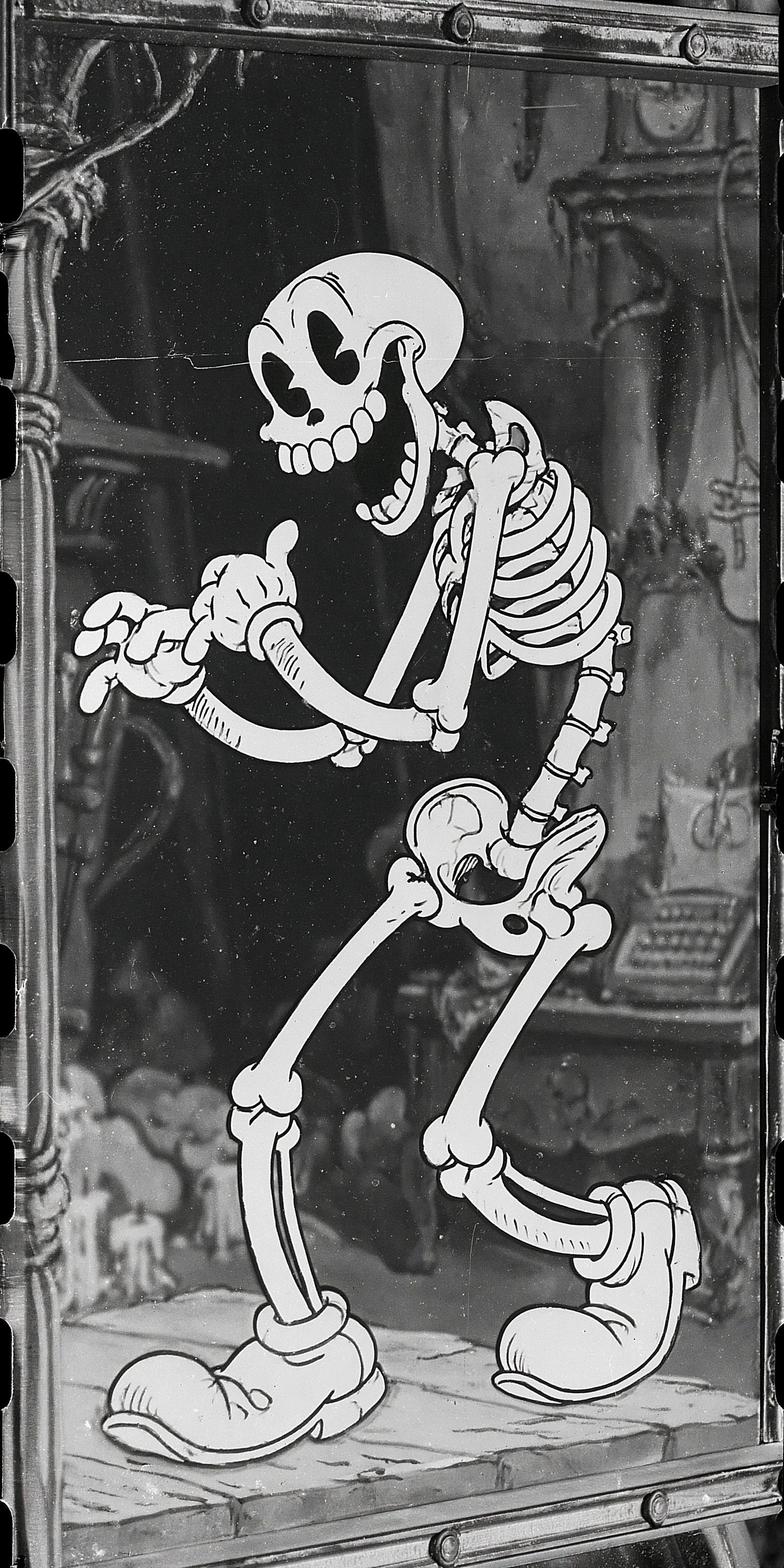 The 1930s Fleischer cartoon character is an anthropomorphic skeleton with expressive eyes and a giant cartoon smile showcasing an old-fashioned ghostly vibe