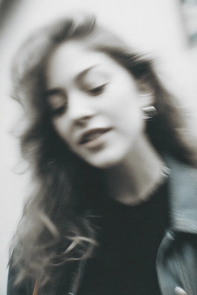 Grainy monochrome photo, soft blur, intimate close-up