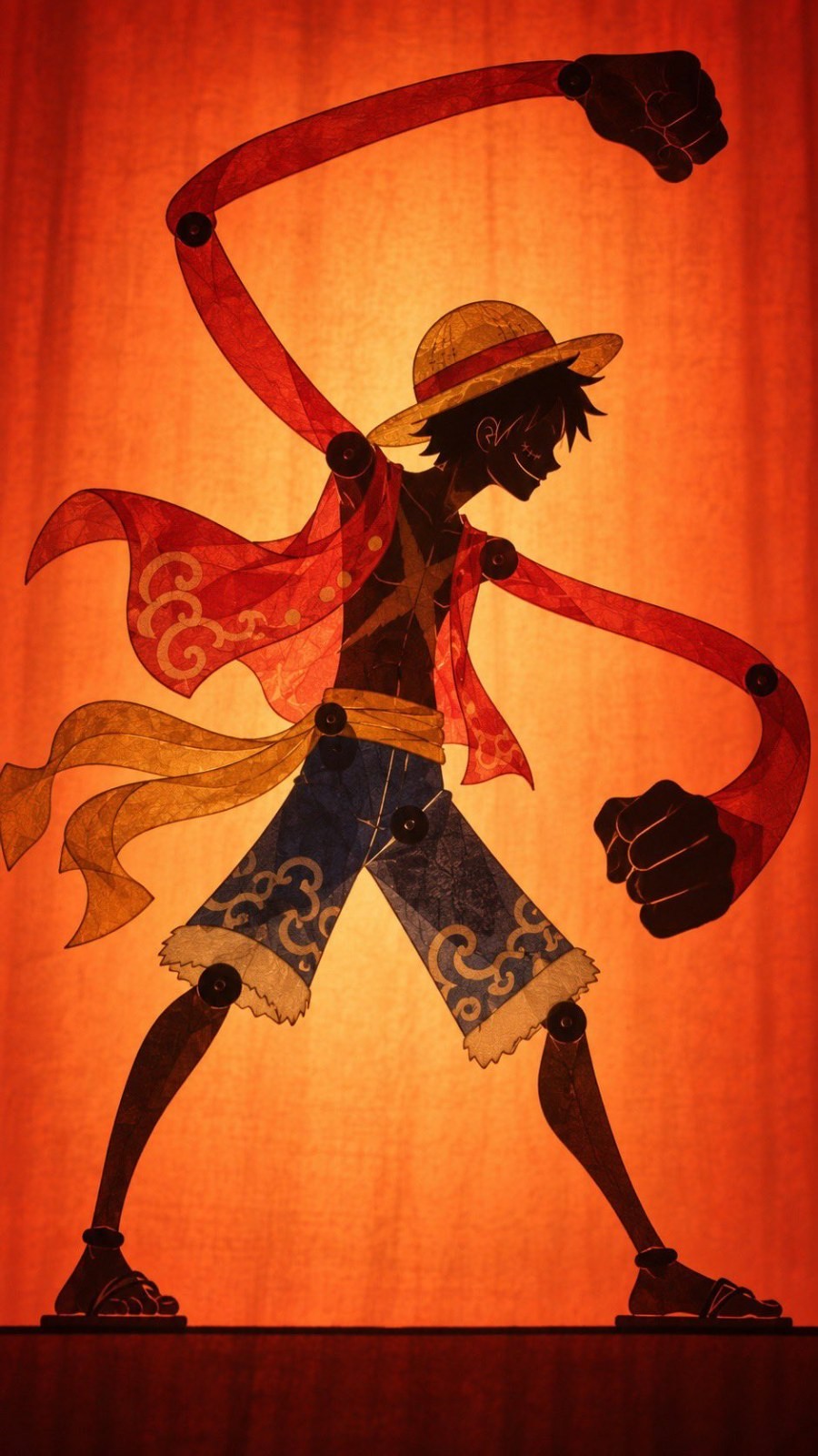 A boy in a straw hat presents a shadow play style